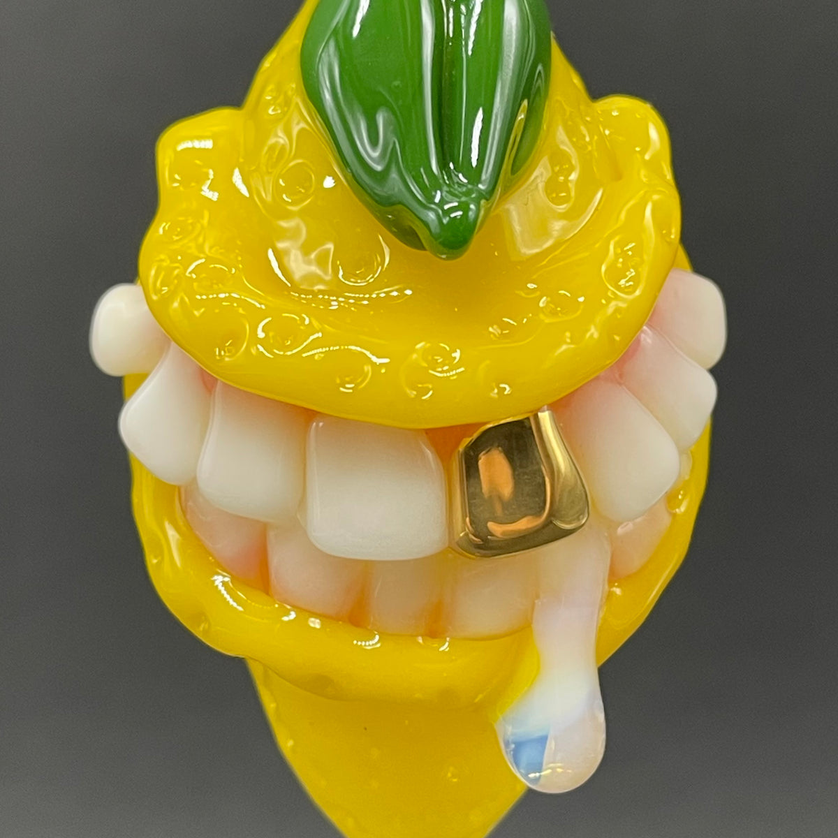 Grinning lemon pendant