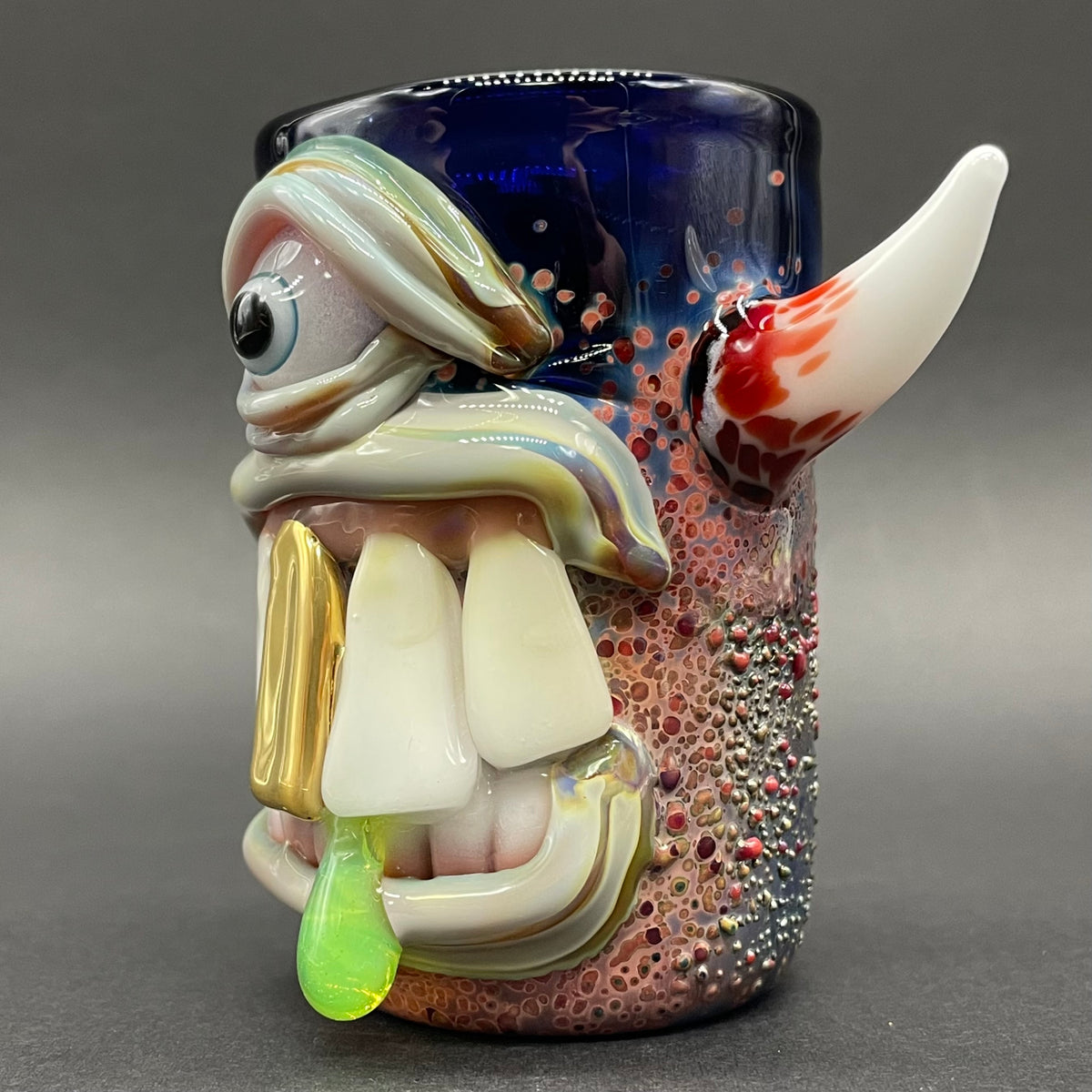 Big tooth Cyclops shot glass hand blown glass art - Leviathan Glass
