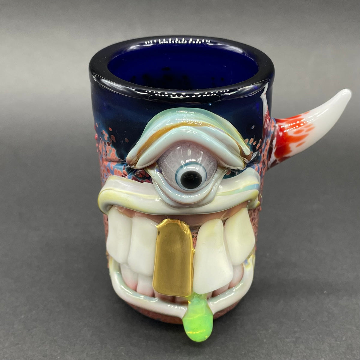 Big tooth Cyclops shot glass hand blown glass art - Leviathan Glass