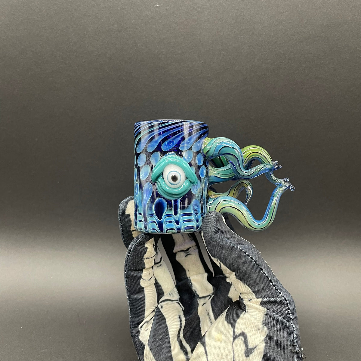 Close-up of Leviathan shot glass - handcrafted glass
