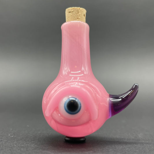 Pink cyclops potion bottle detail view - premium glass art