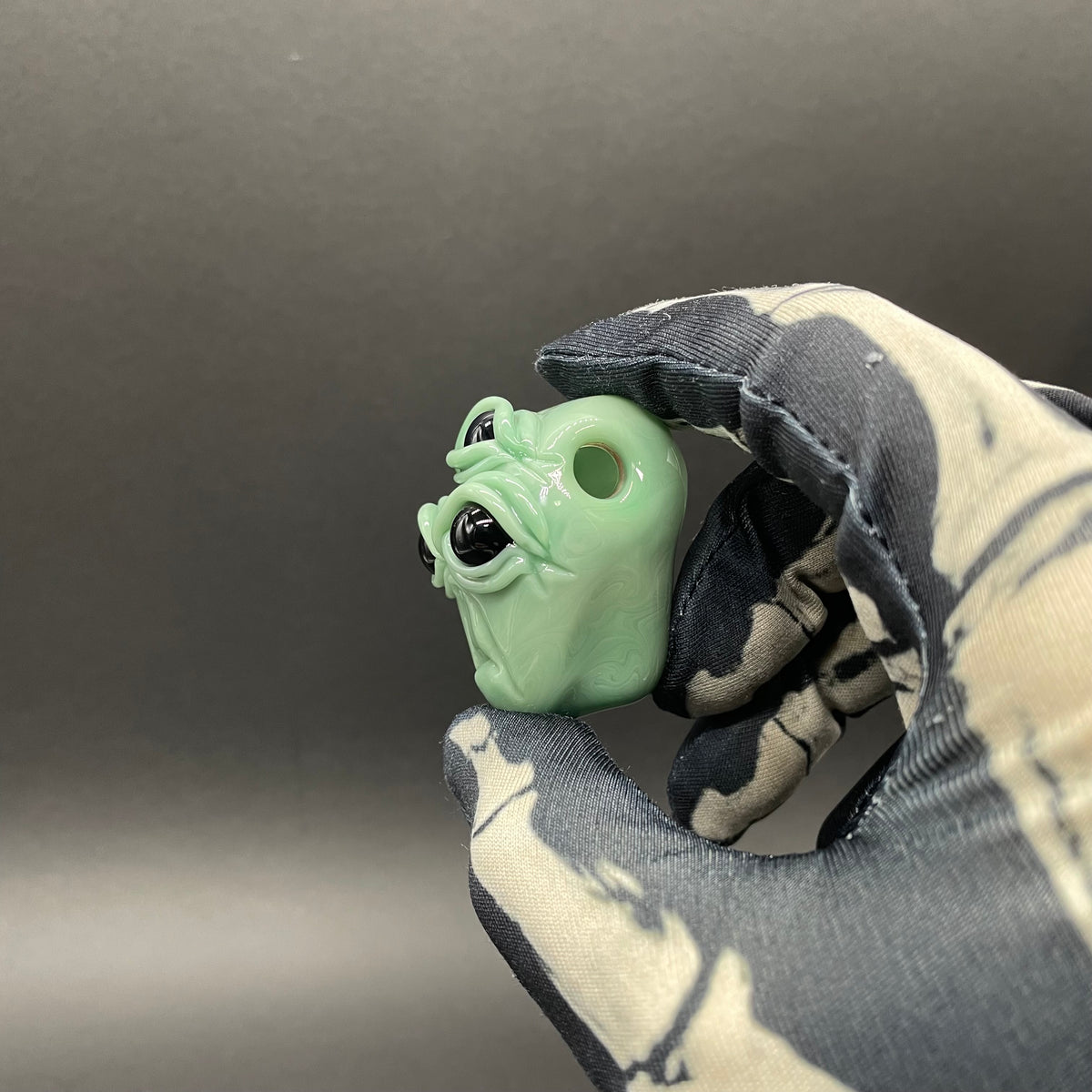 Time manipulating three eye glass alien pendant
