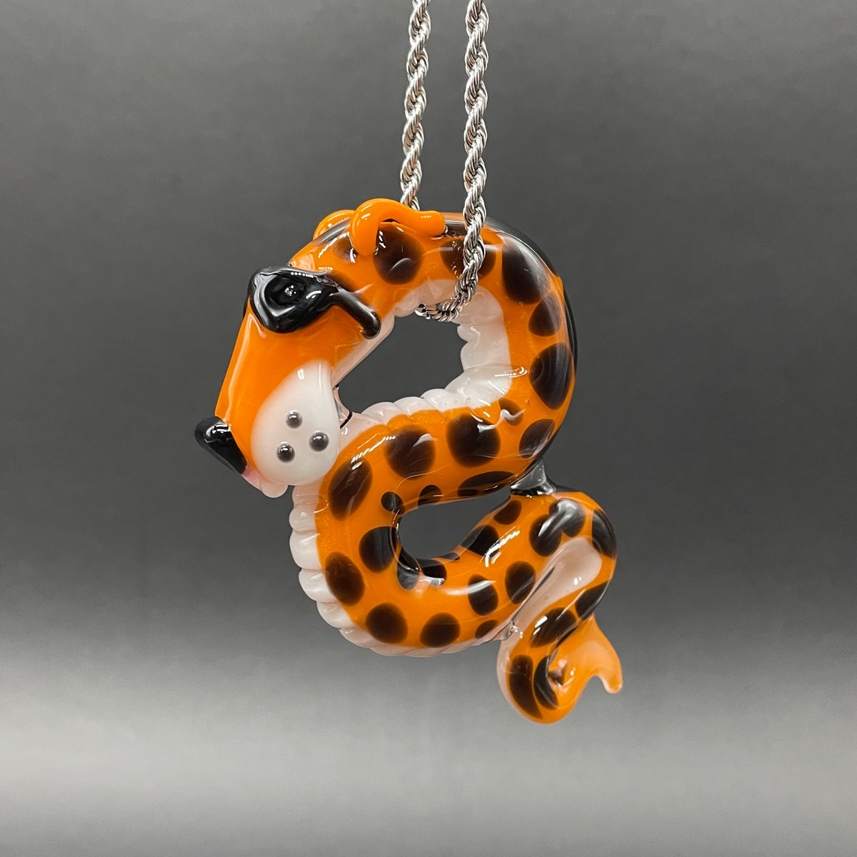 Hand-blown glass Slithering Chester Cheetah glass pendant by Leviathan Glass