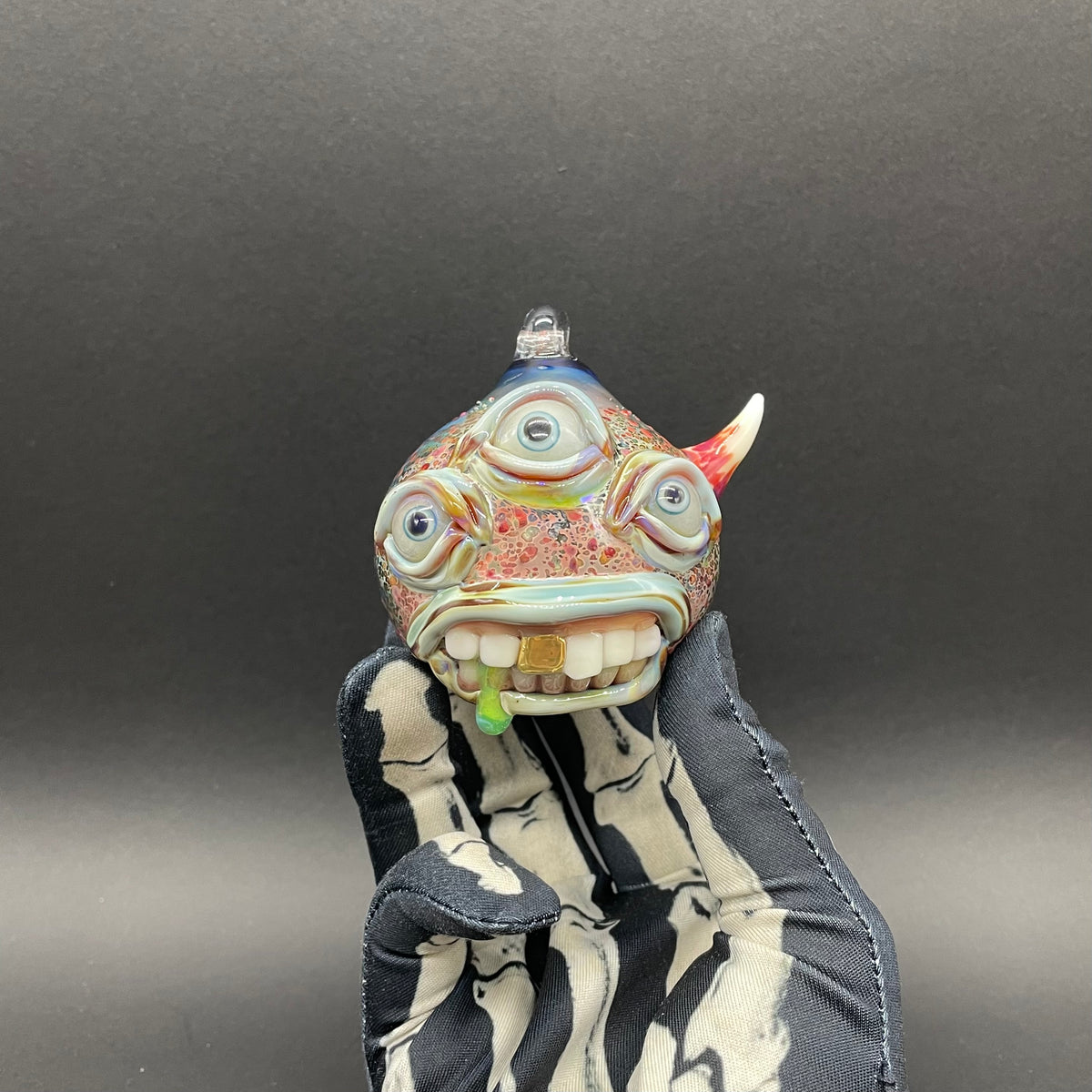 Close-up of Triclops ornament - handcrafted glass