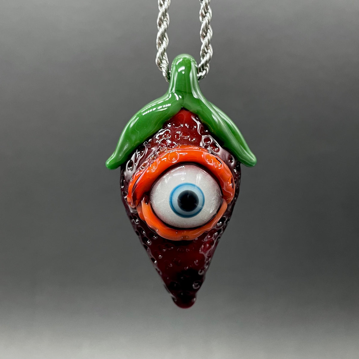 Hand-blown glass Cyclops strawberry pendant by Leviathan Glass
