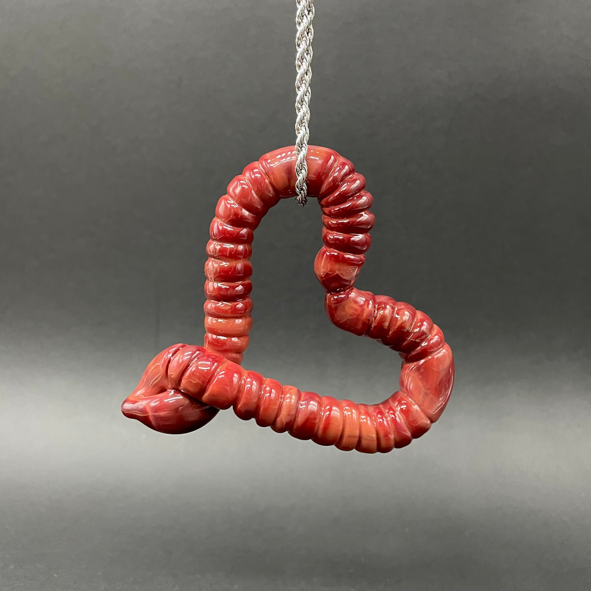 Hand-blown glass Large glass earthworm heart shaped pendant by Leviathan Glass
