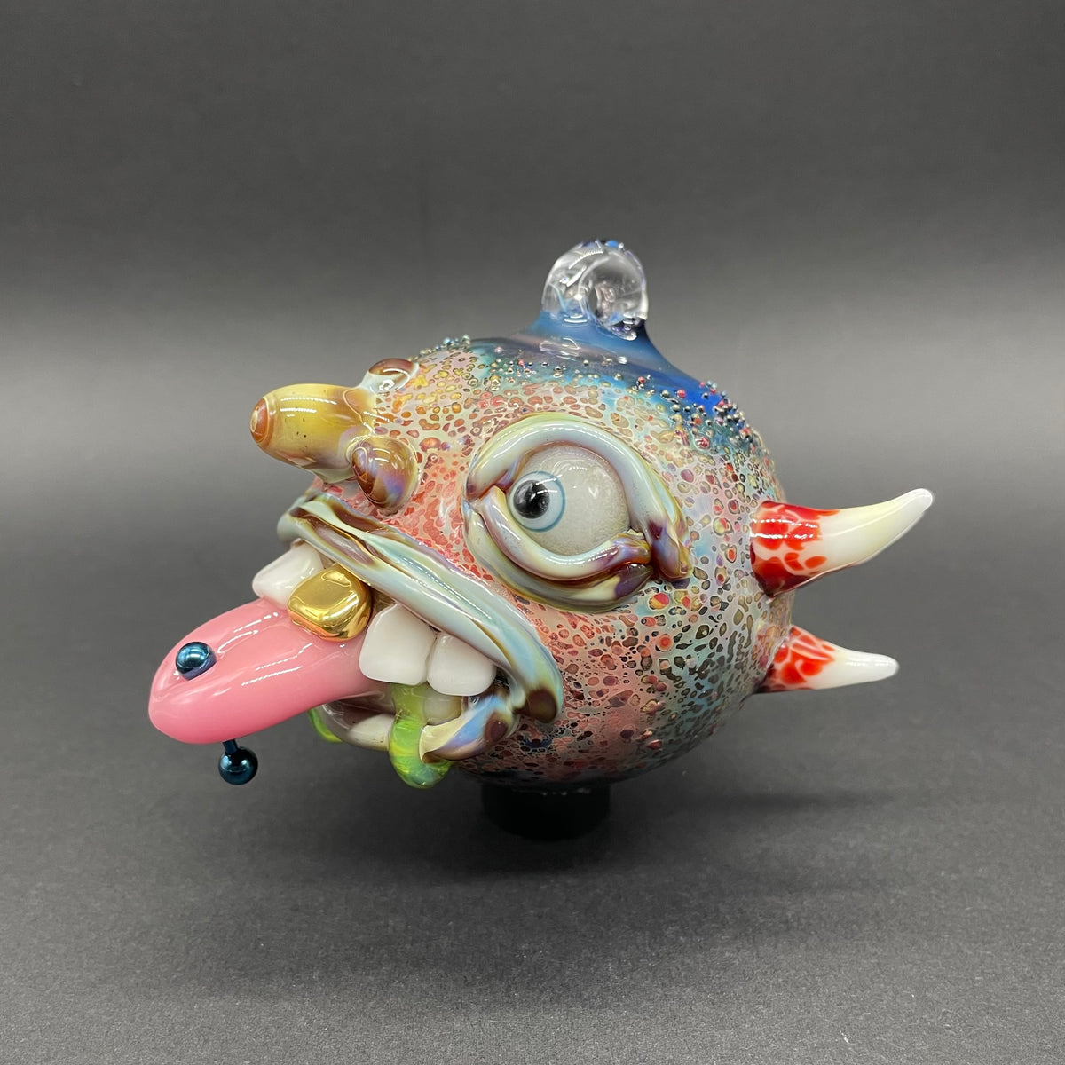 Hand-blown glass Pierced tongue cyclops ornament by Leviathan Glass