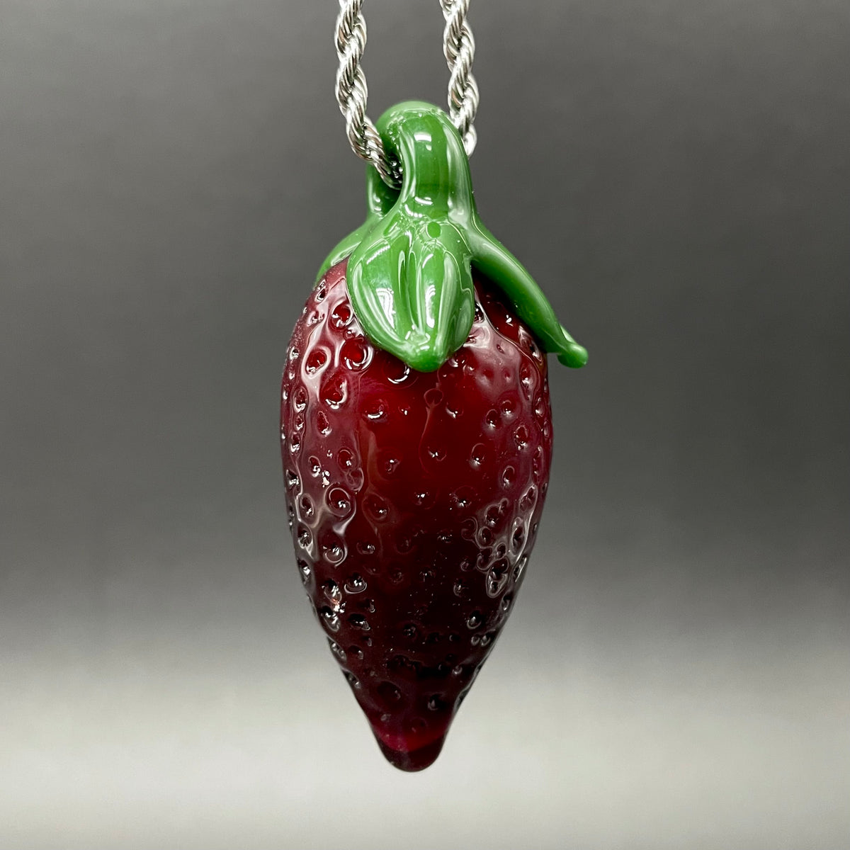 Close-up of Strawberry pendant - handcrafted glass