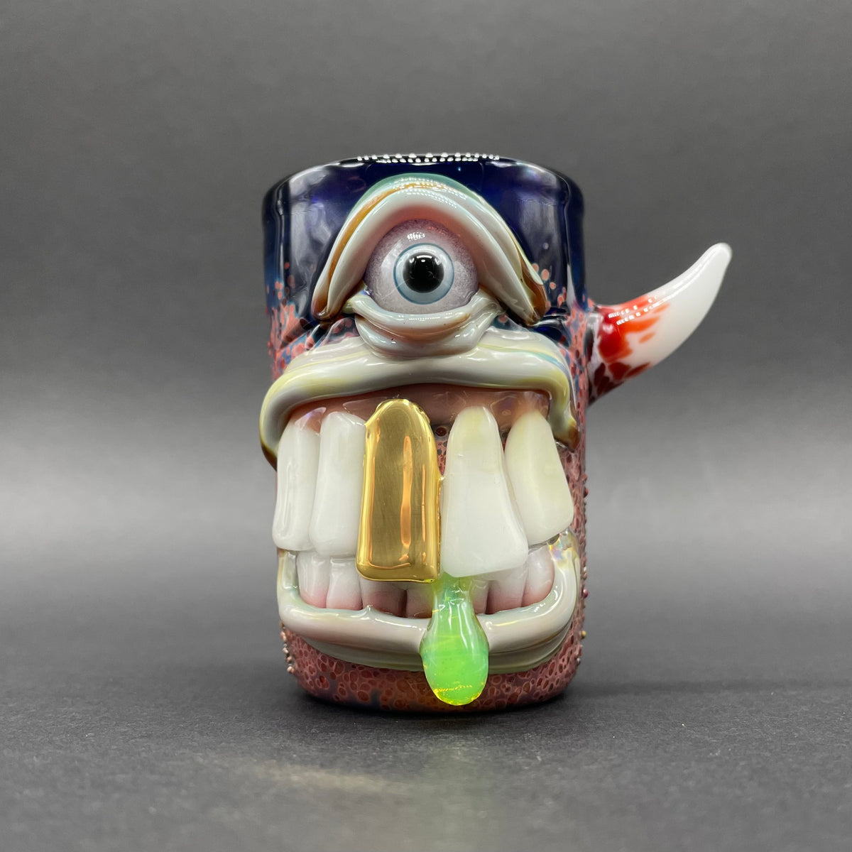 Big tooth Cyclops shot glass hand blown glass art - Leviathan Glass