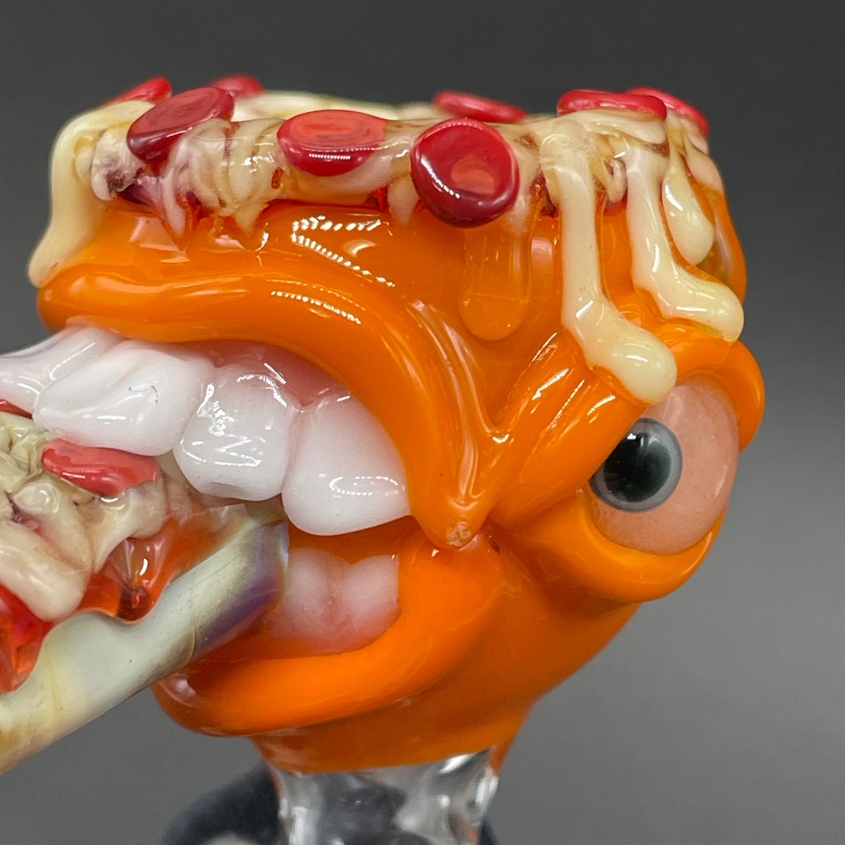 14mm 4 hole orange pizza fiend slide by Leviathan Glass - artisan detail