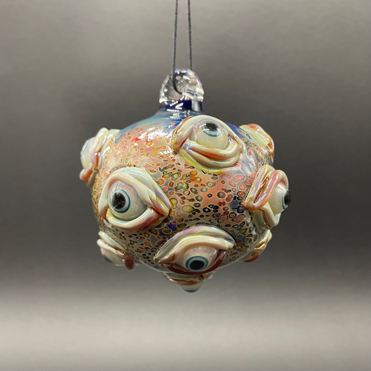 Hand-blown glass All seeing Argus ornament by Leviathan Glass