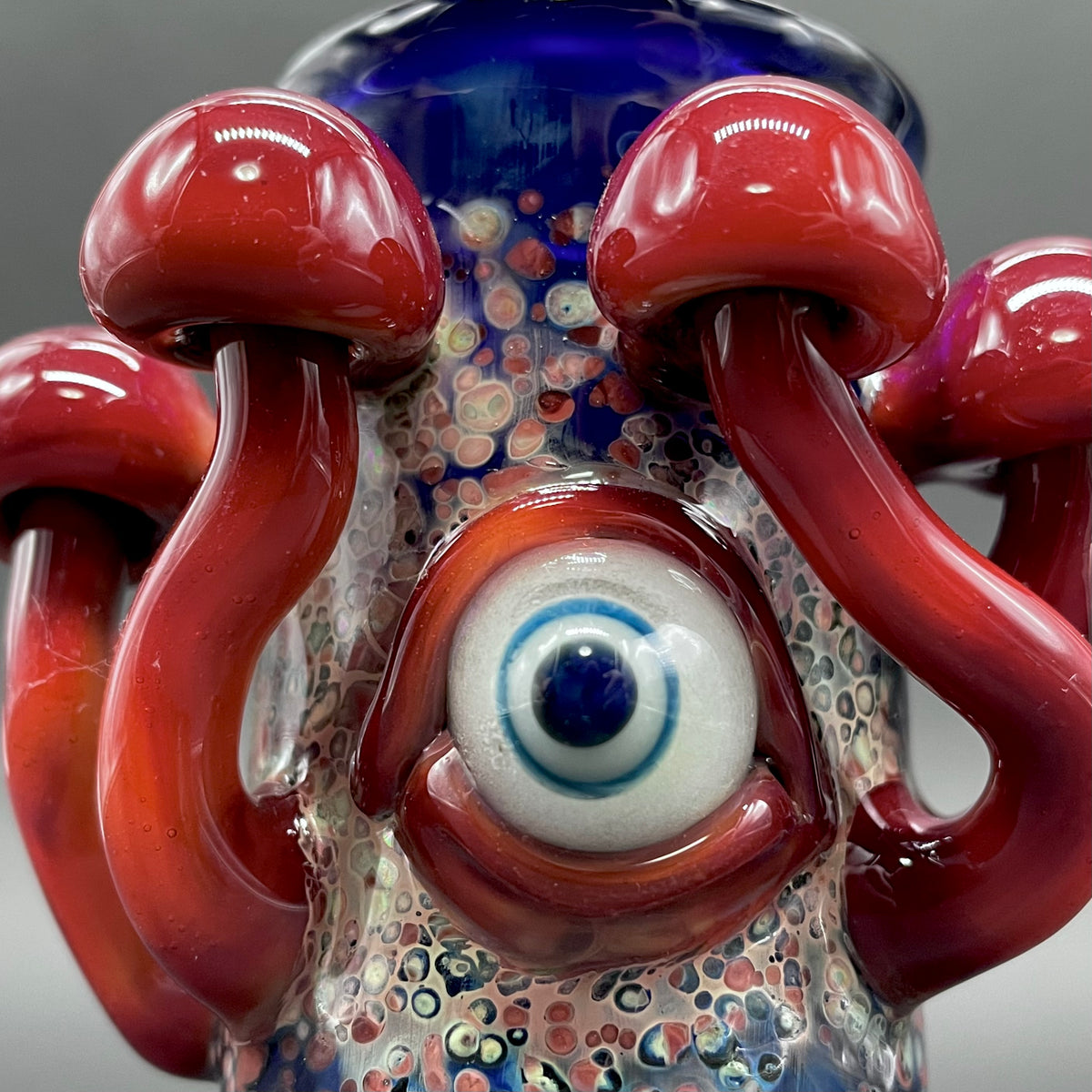 Close-up of Tequila sunrise shot glass - handcrafted glass