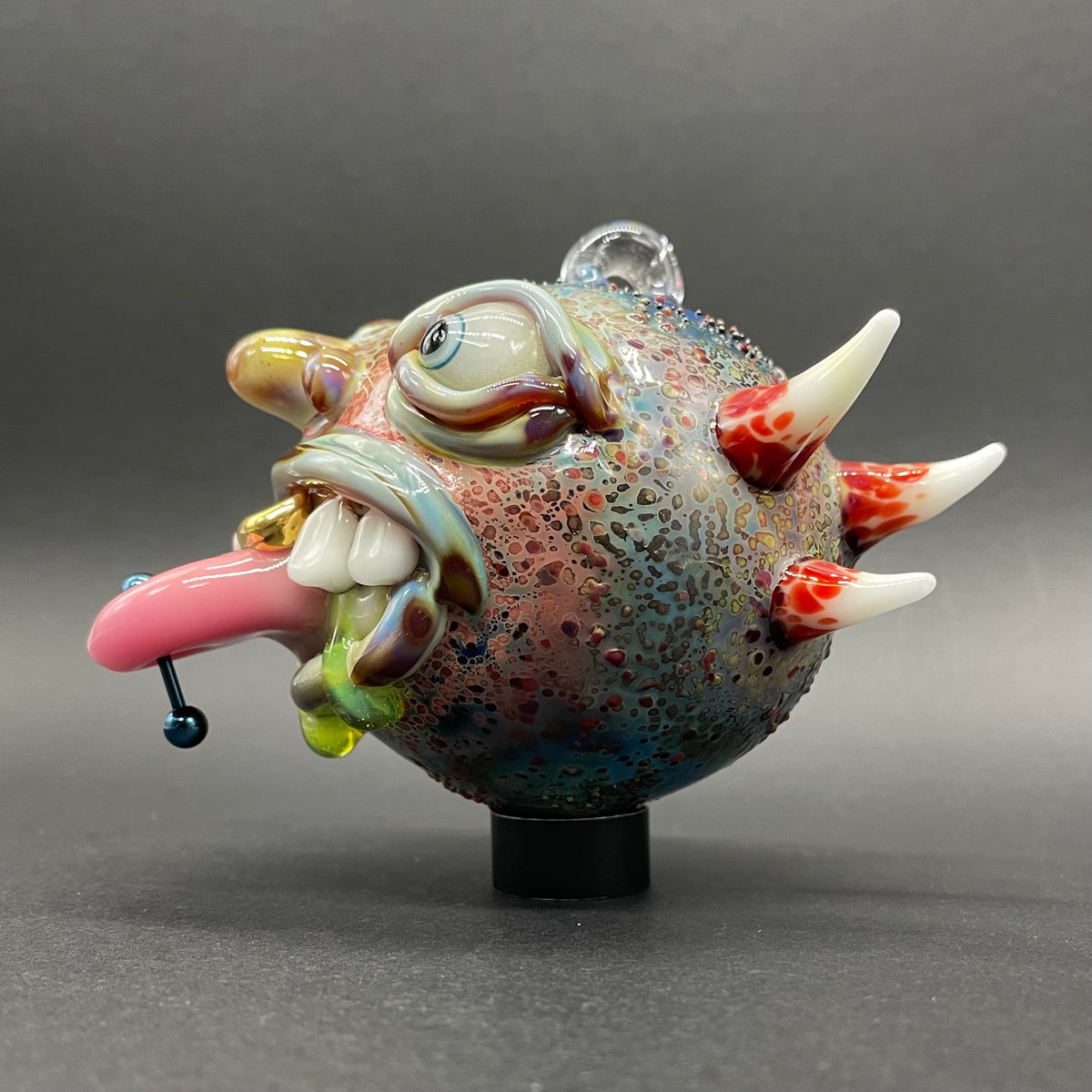 Pierced tongue cyclops ornament detail view - premium glass art