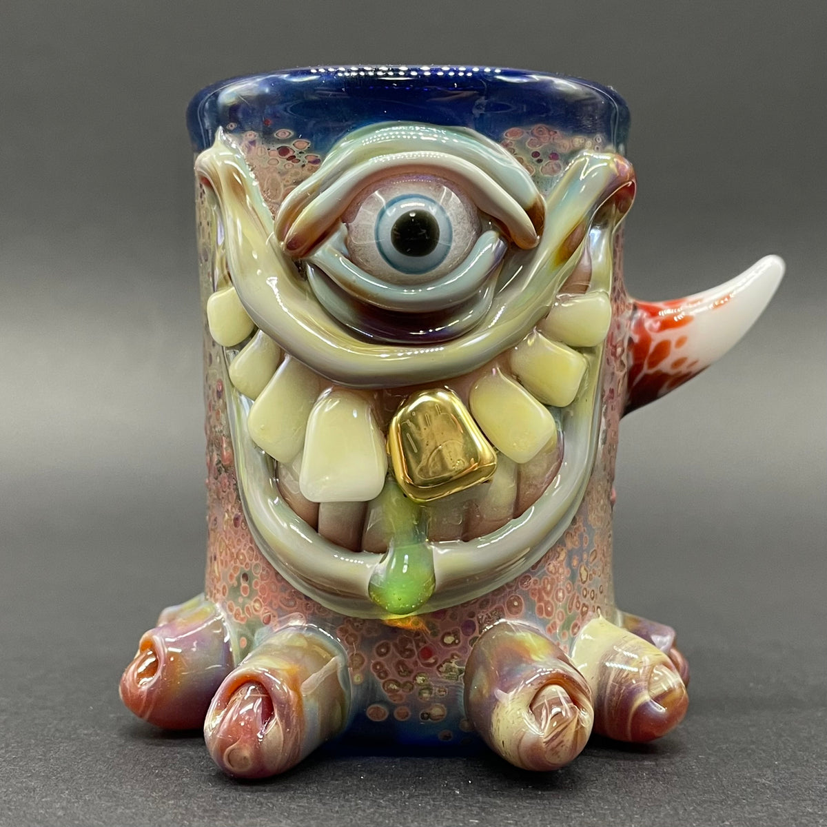 Close-up of Twinkle toes shot glass - handcrafted glass