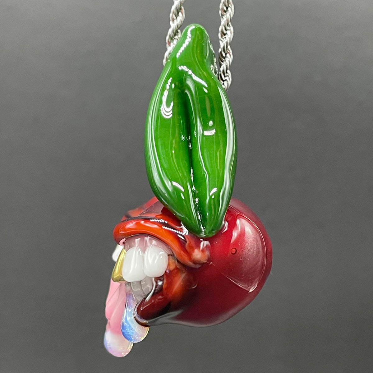 Cherry Lover handblown glass pendant - paired red cherries with green stem, each with open grinning mouth, white teeth, gold tooth, pink tongues, silver rope chain - Leviathan Glass