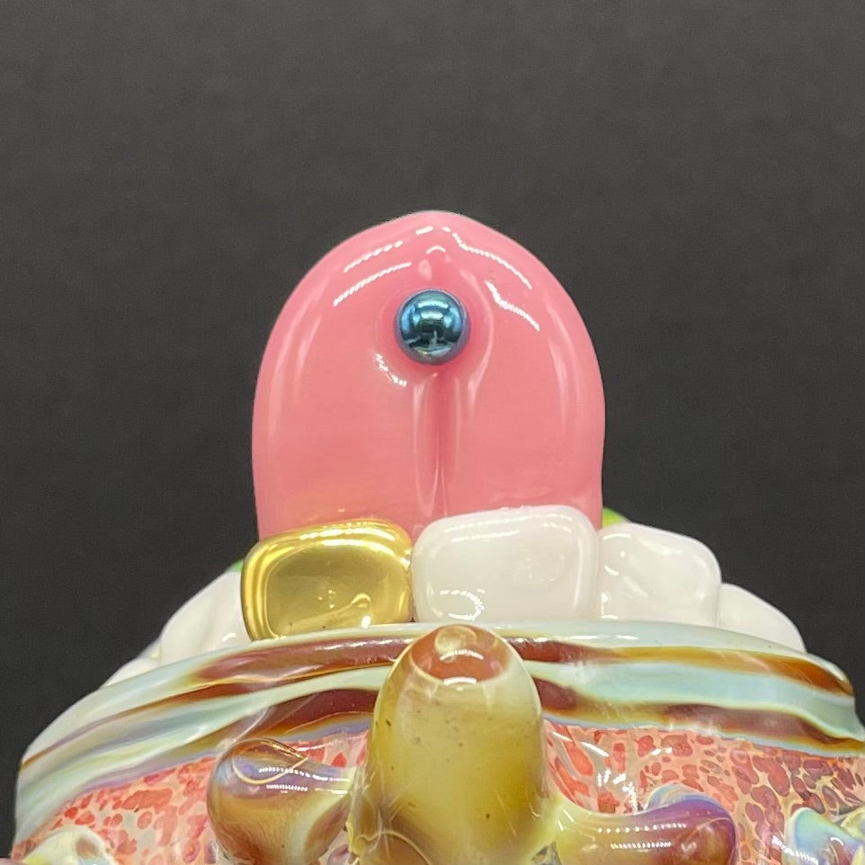 Artisan glass Pierced tongue cyclops ornament - detailed craftsmanship