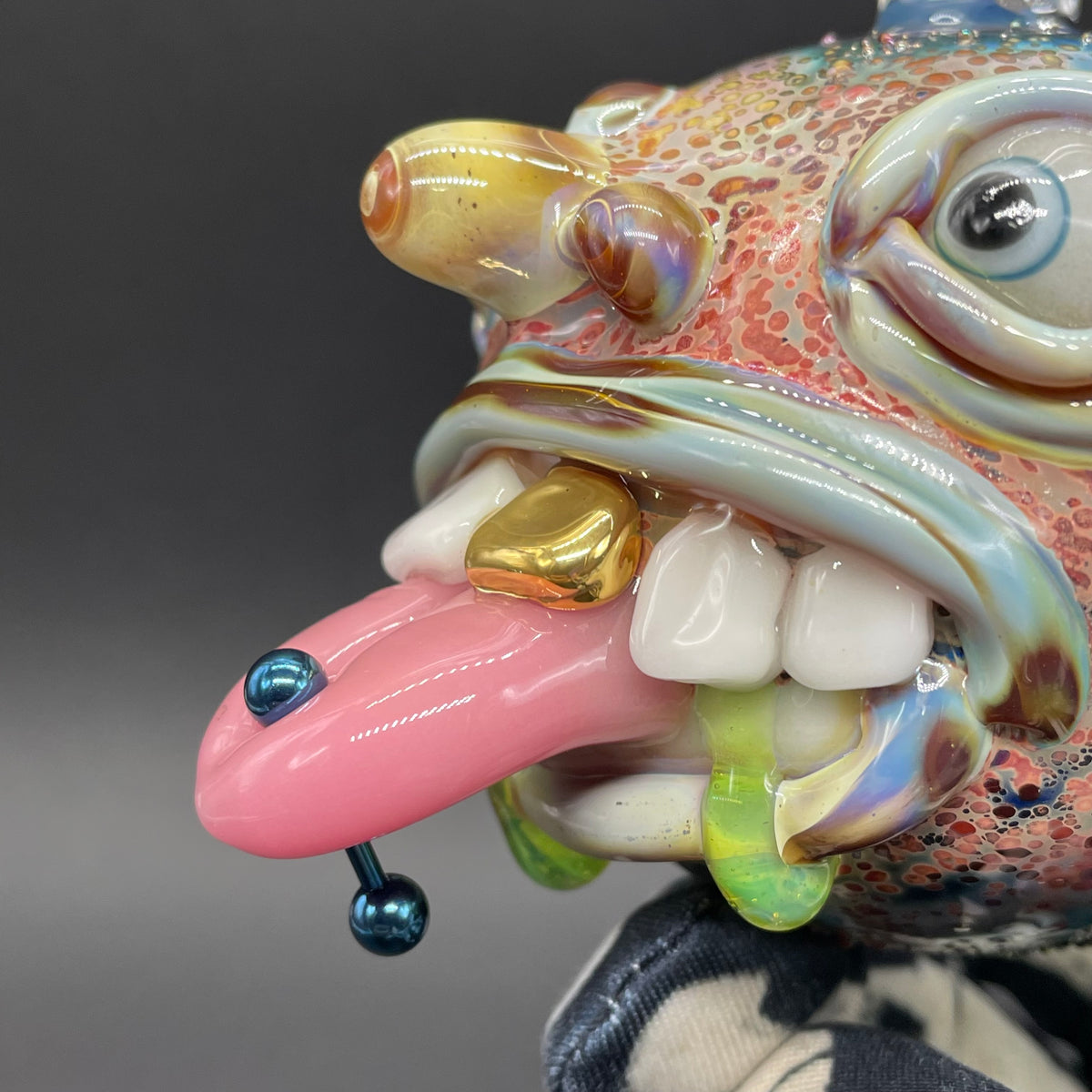 Pierced tongue cyclops ornament detail view - premium glass art