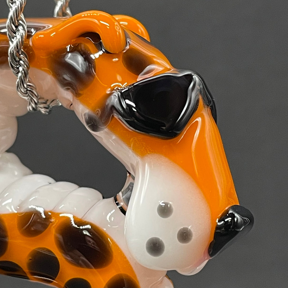 Hand-blown glass Slithering Chester Cheetah glass pendant by Leviathan Glass
