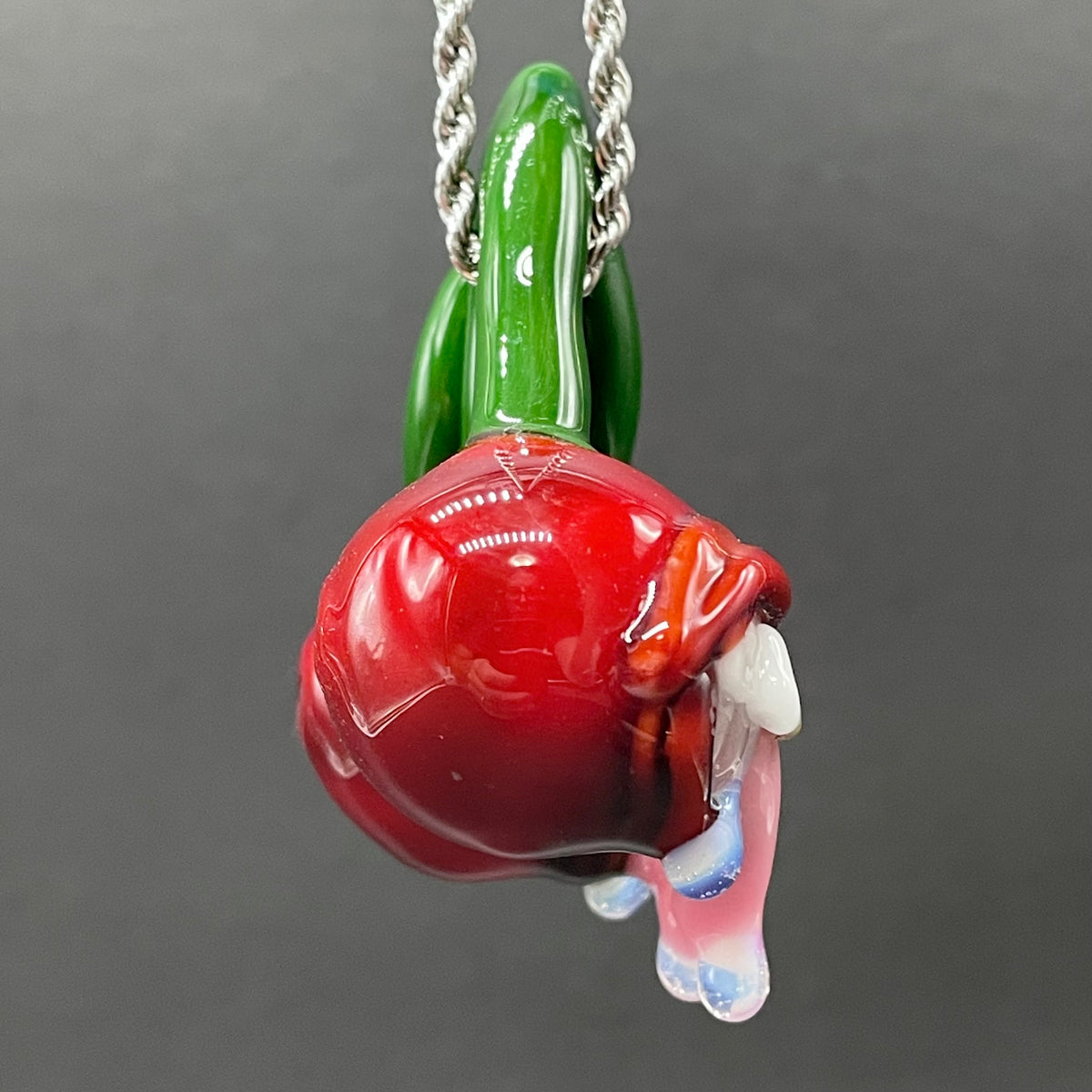 Cherry Lover handblown glass pendant - paired red cherries with green stem, each with open grinning mouth, white teeth, gold tooth, pink tongues, silver rope chain - Leviathan Glass