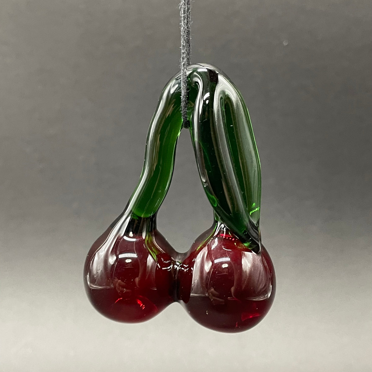 Close-up of Transparent cherry pendant - handcrafted glass