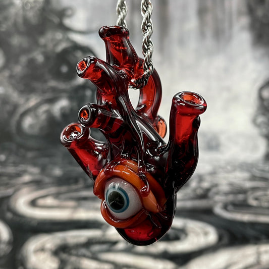 Anatomical cyclops heart pendant detail view - premium glass art