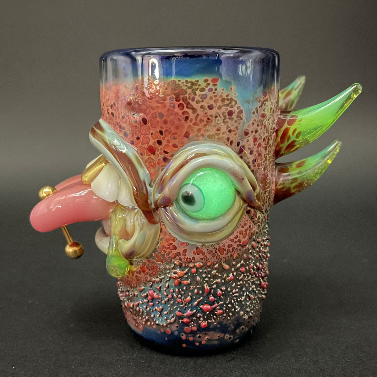 Close-up of Pierced Tongue Shot Glass - handcrafted glass