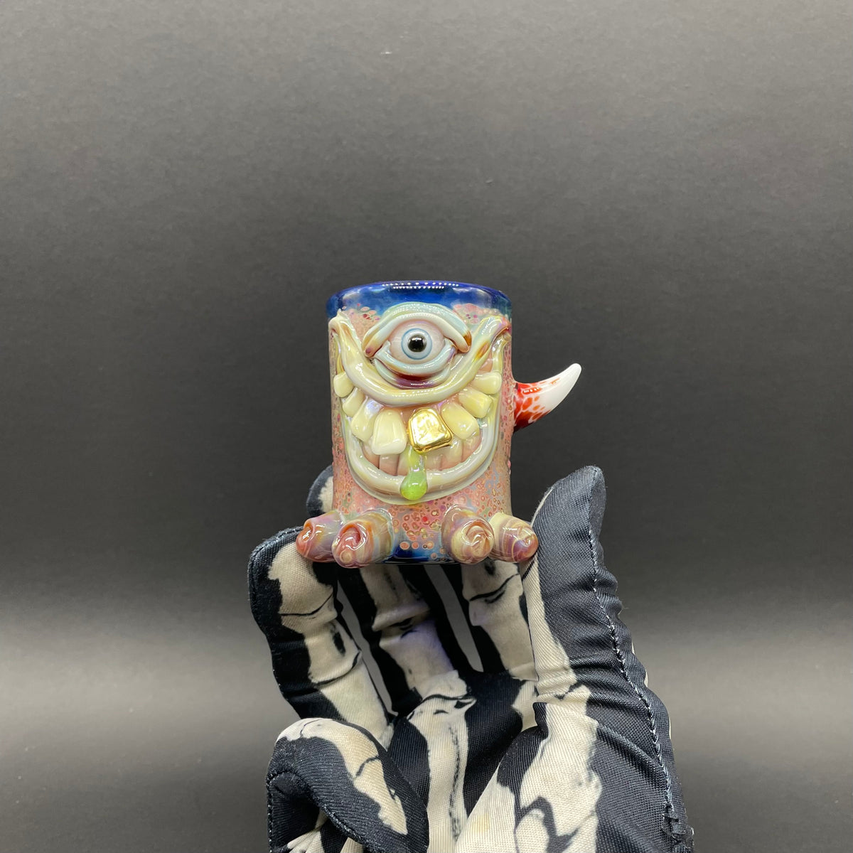 Close-up of Twinkle toes shot glass - handcrafted glass