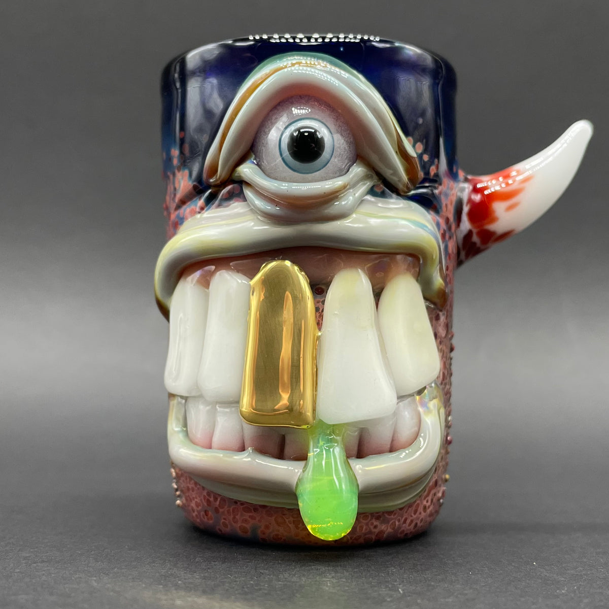 Big tooth Cyclops shot glass hand blown glass art - Leviathan Glass