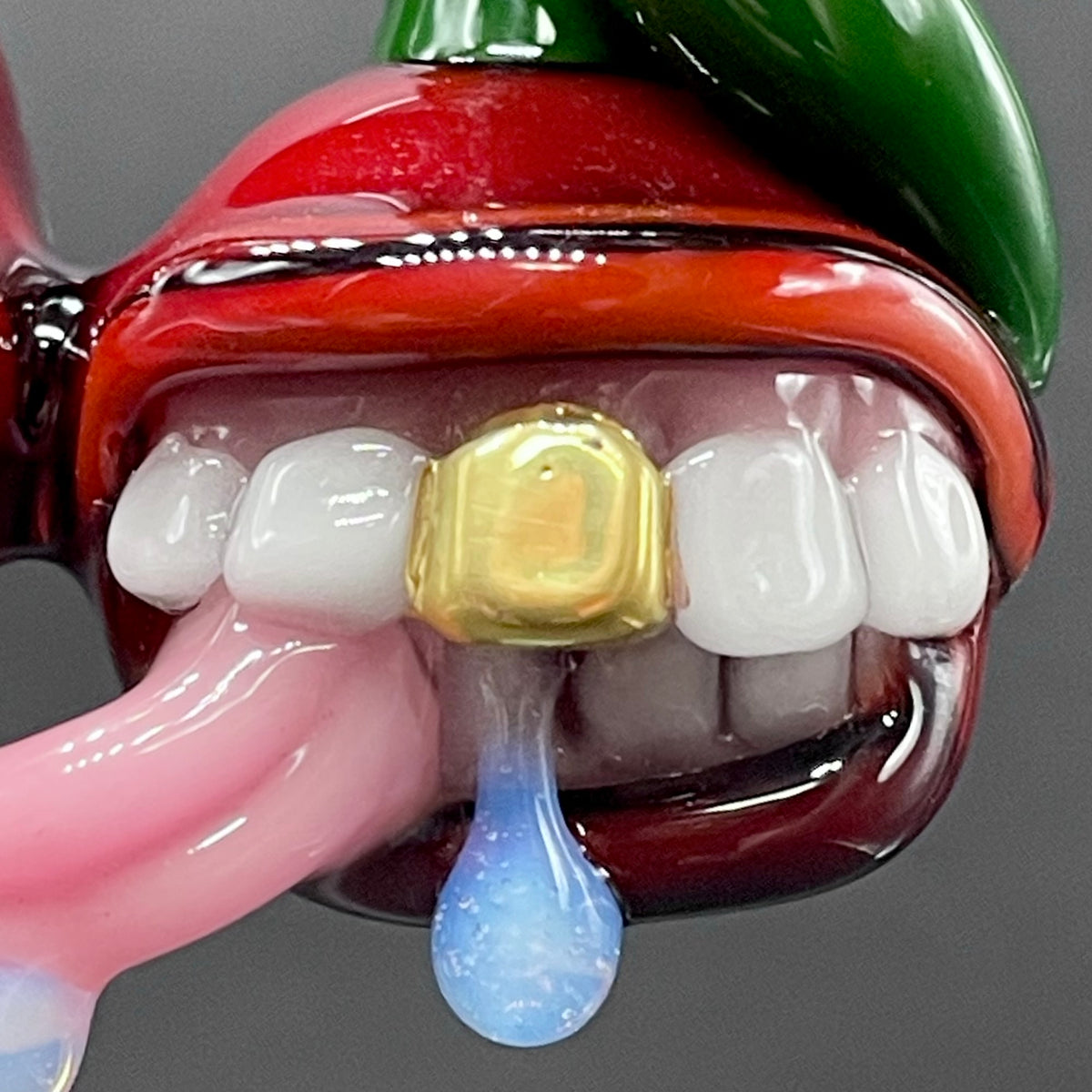 Cherry Lover handblown glass pendant - paired red cherries with green stem, each with open grinning mouth, white teeth, gold tooth, pink tongues, silver rope chain - Leviathan Glass