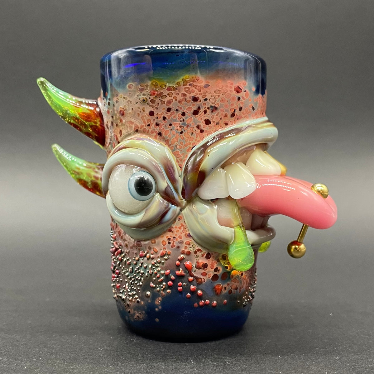 Close-up of Pierced Tongue Shot Glass - handcrafted glass