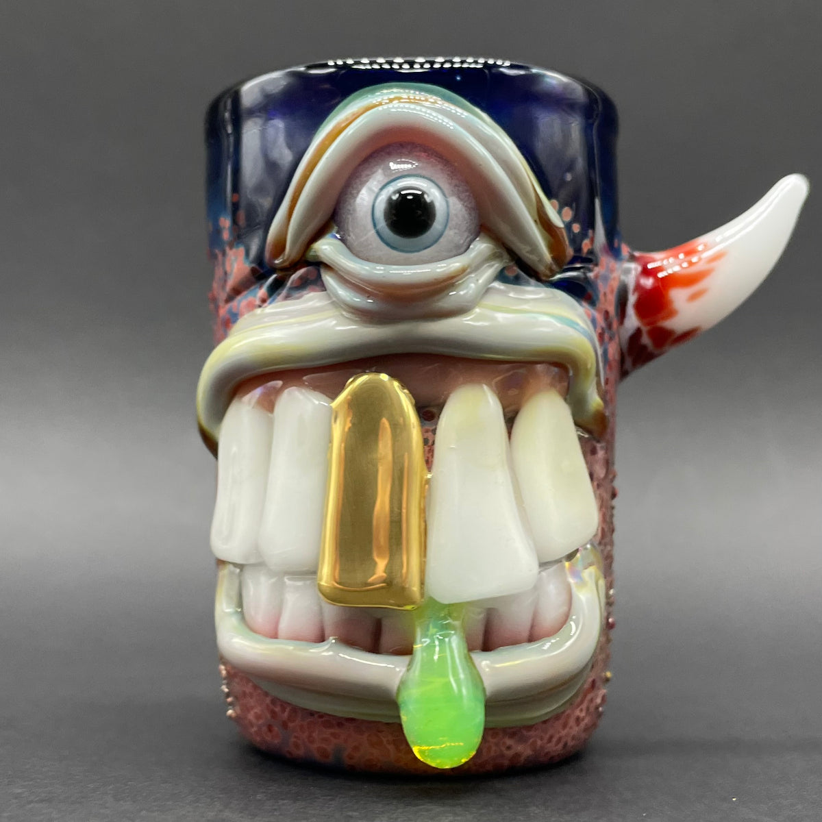 Big tooth Cyclops shot glass hand blown glass art - Leviathan Glass