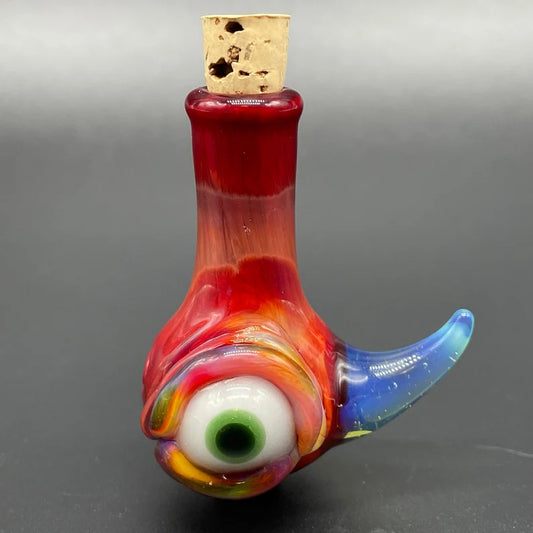 Sunrise red cyclops potion bottle detail view - premium glass art