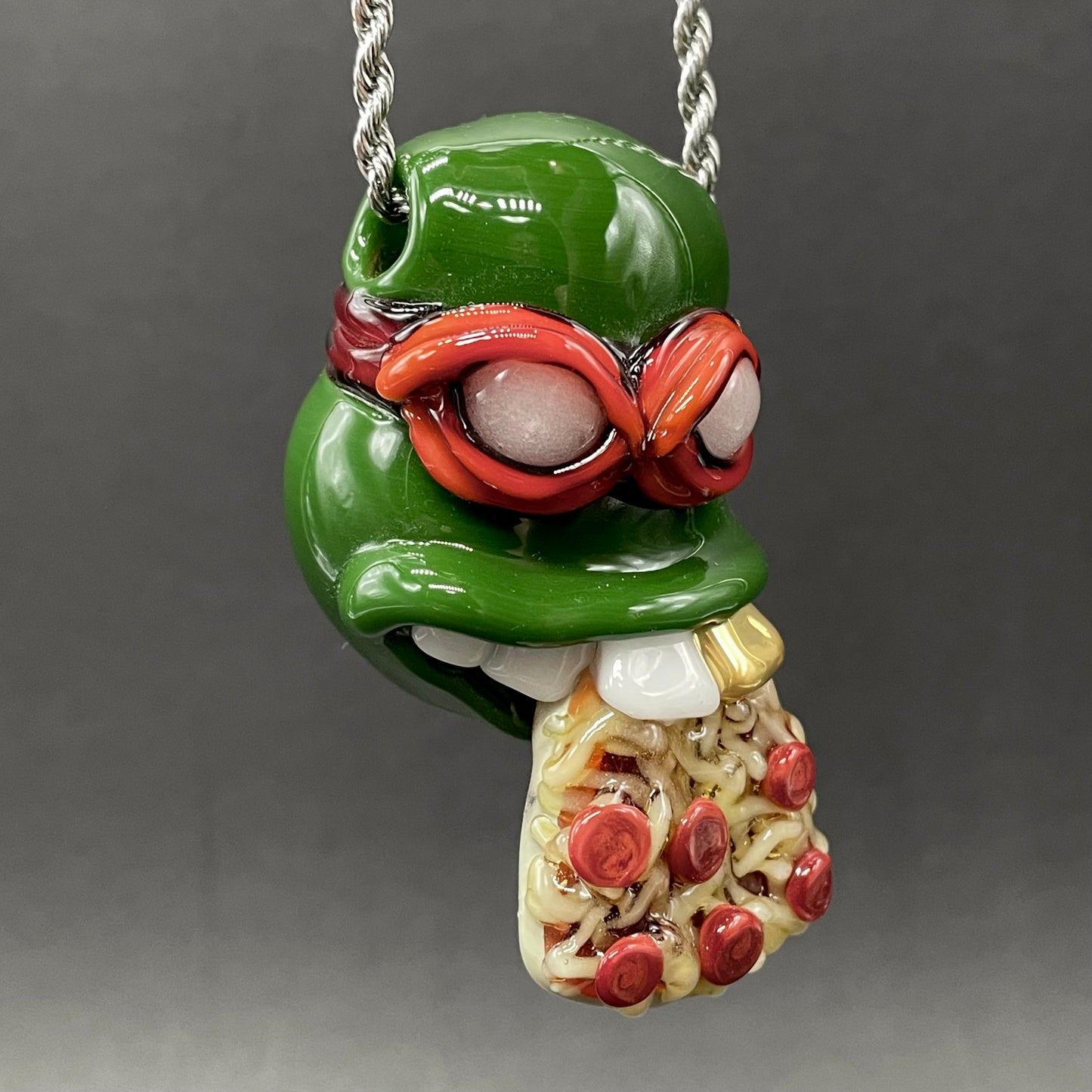 Glass Ninja Turtle Pendant – Handmade Raphael Pizza Necklace, TMNT Fan Jewelry detail view - premium glass art