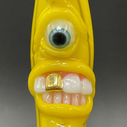 Grinning glass banana pendant