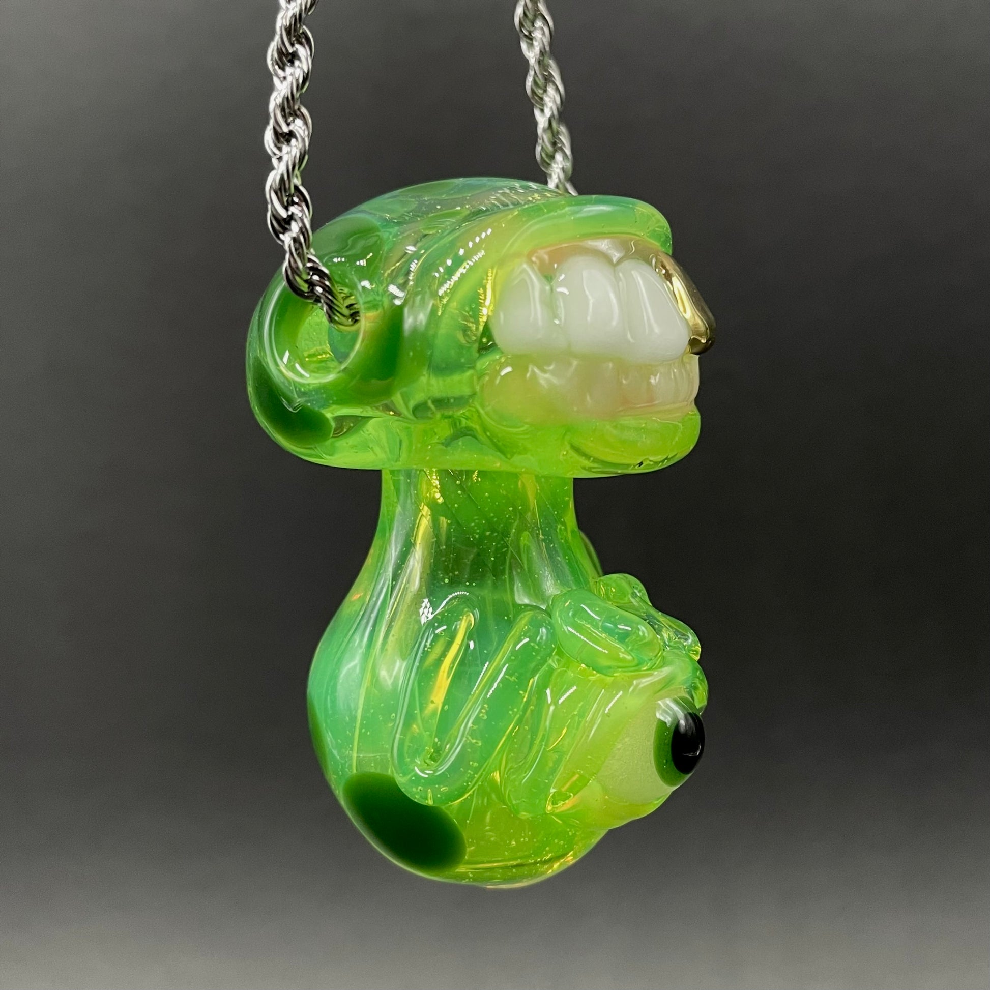 Close-up of Green slime mushroom monster - handcrafted glass