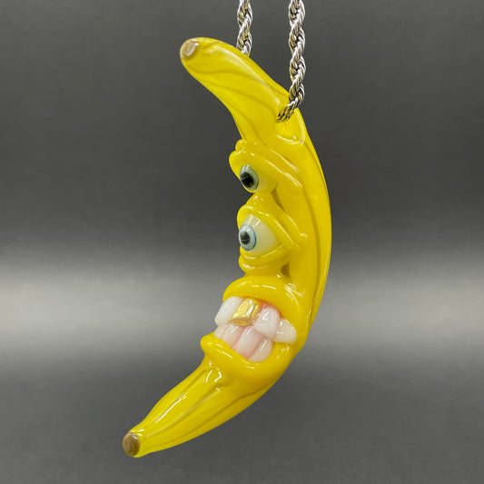 Grinning glass banana pendant