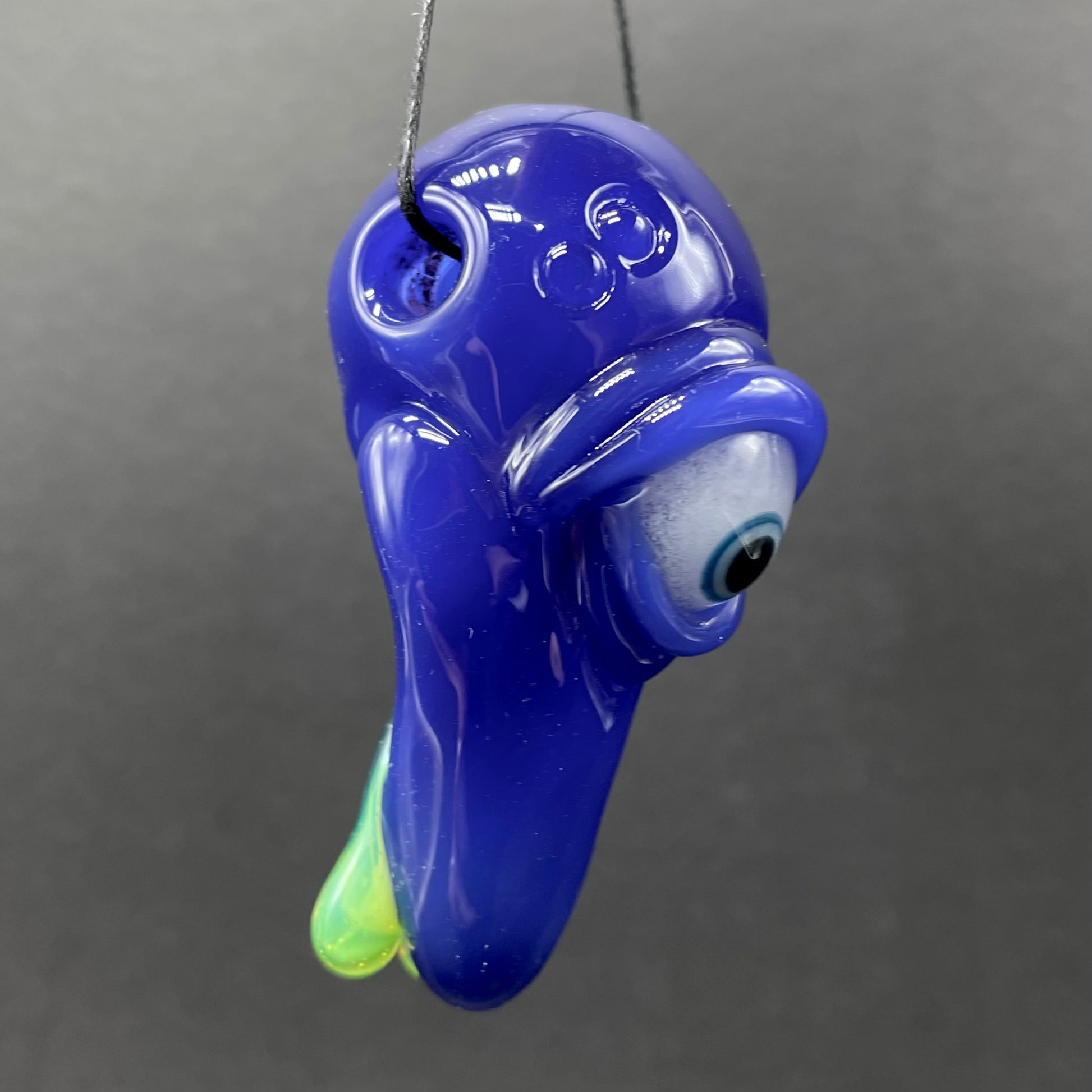 Close-up of running nose glass pendant - handcrafted glass