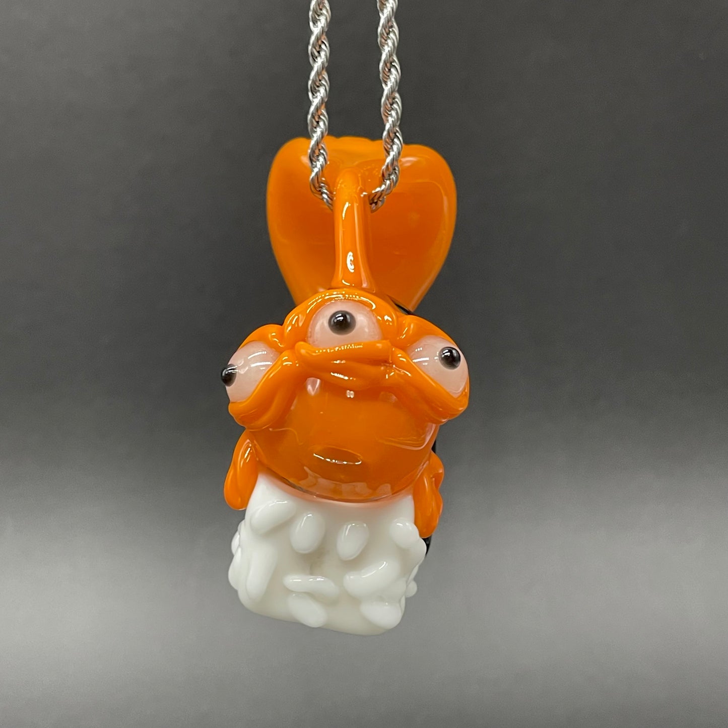 Mutant three eyed fish sushi glass pendant