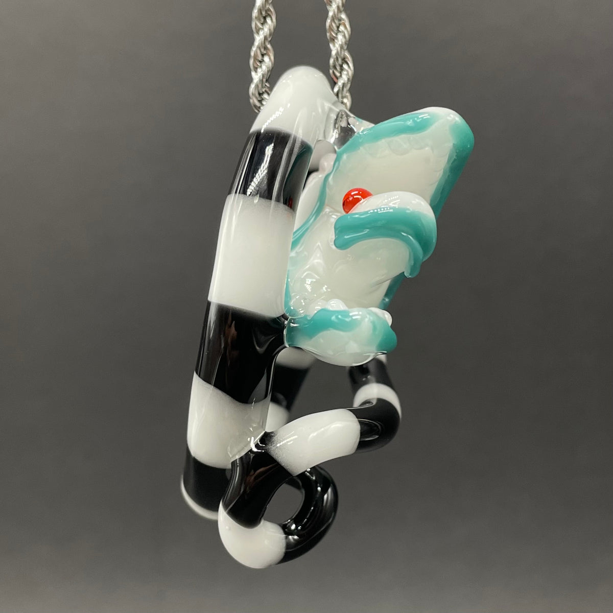 Beetlejuice Inspired handblown solid glass Sandworm sculpture - coiled black and white striped sandworm with white worm head, teal tongue, red eyes - Leviathan Glass
