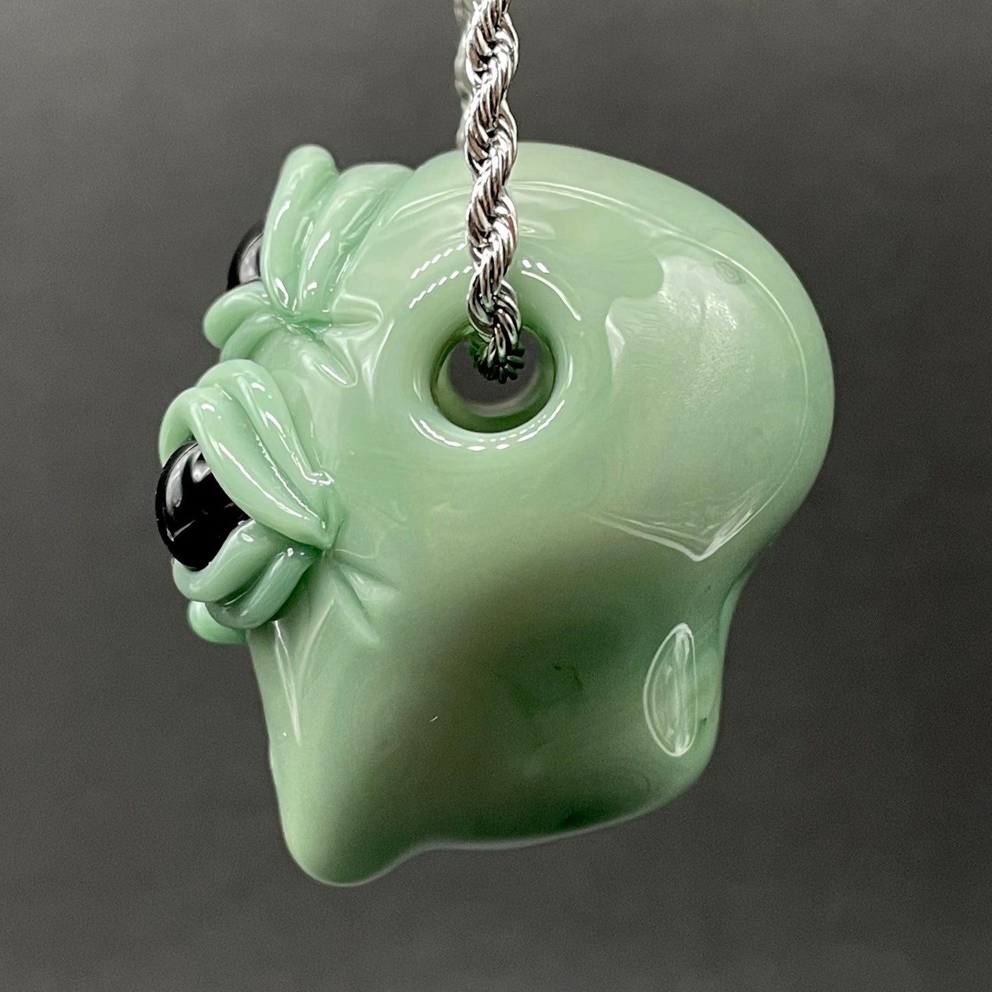 Time manipulating three eye glass alien pendant