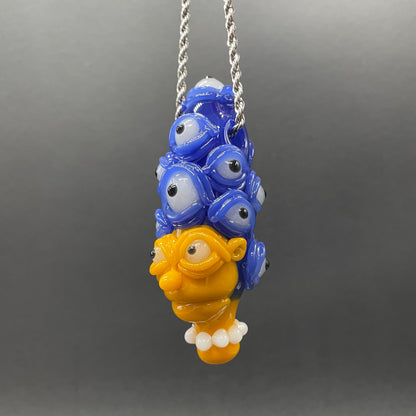 Marge Simpson Mutant handblown glass pendant - yellow Marge Simpson face with towering stack of blue cyclops creatures forming her hair, white pearl beads, silver rope chain - Leviathan Glass