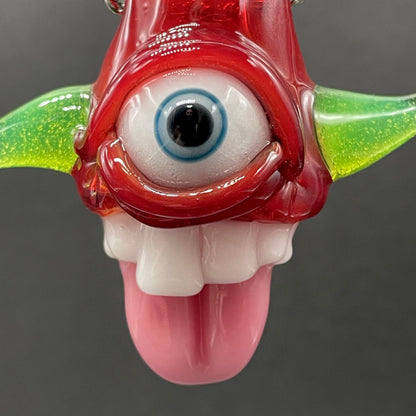 Close-up of Licky McOneEye glass pendant - handcrafted glass