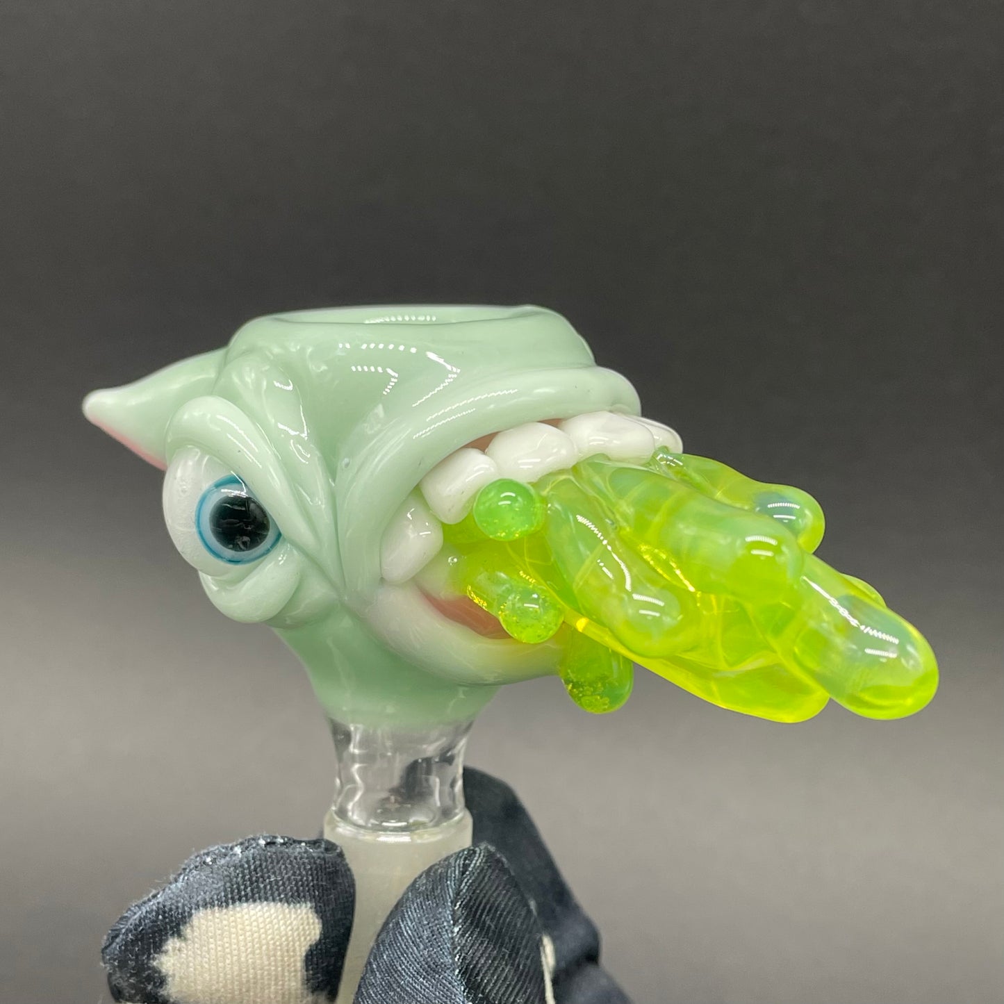 Close-up of 14mm 4 hole barf slide - handcrafted glass