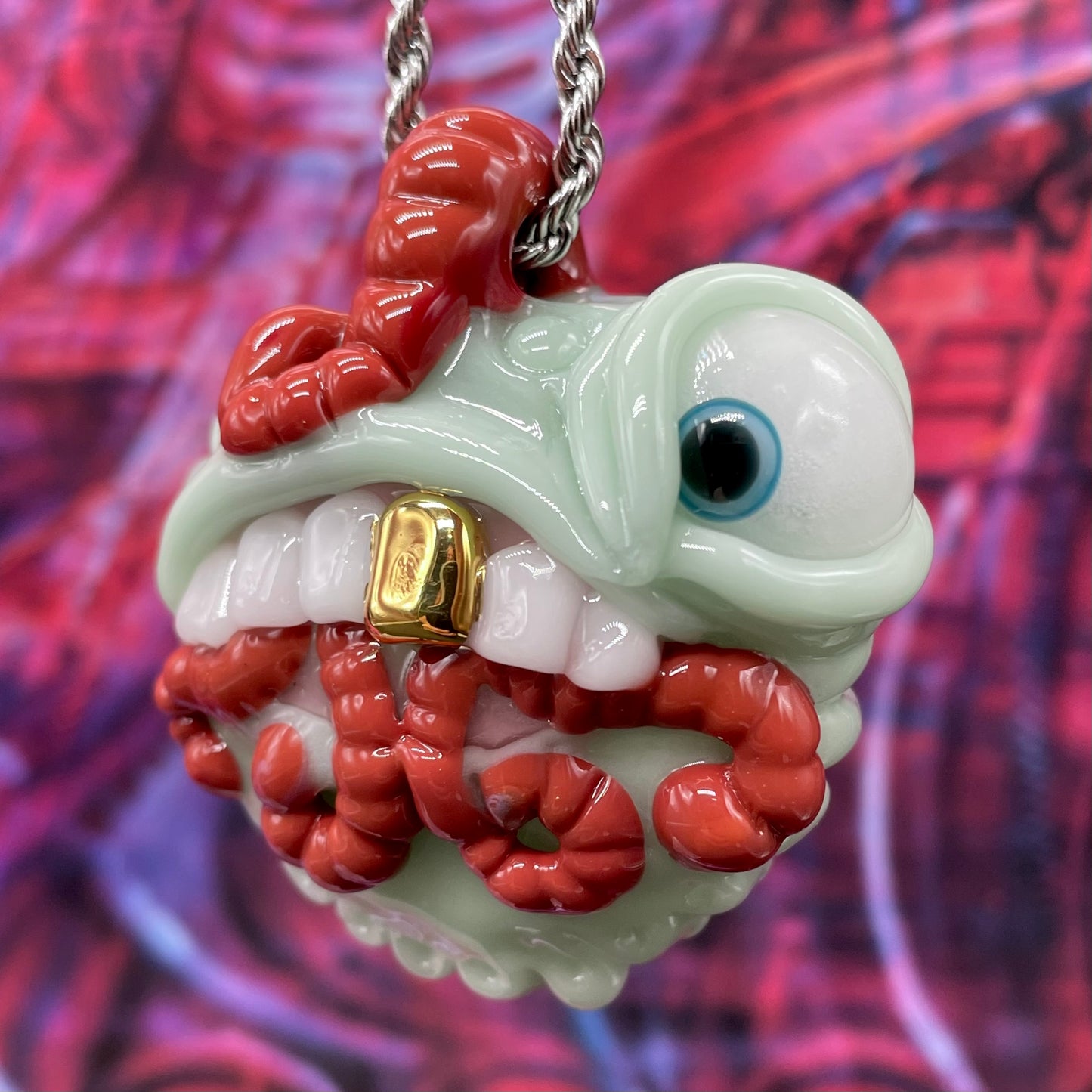Close-up of Worm eater pendant - handcrafted glass