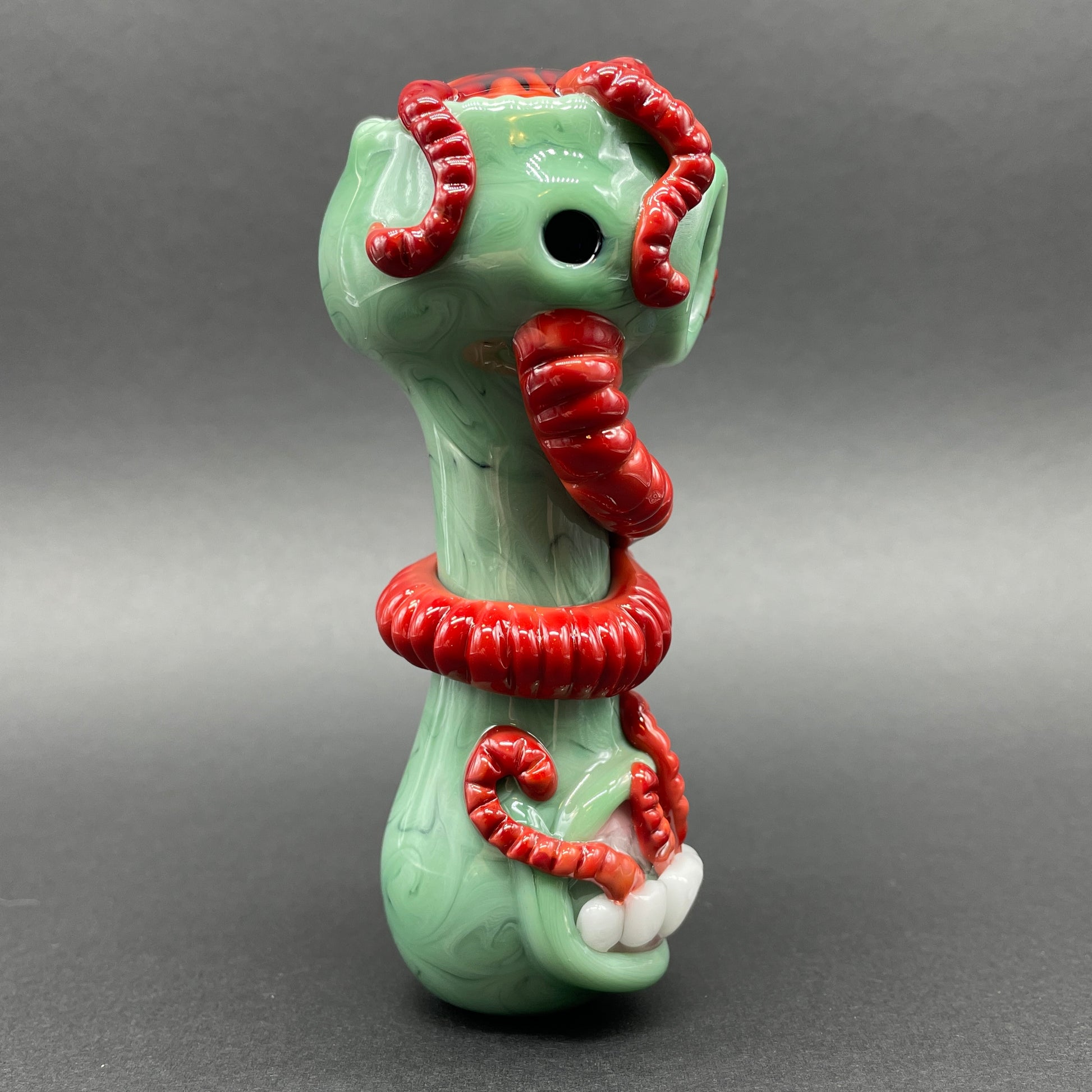 Close-up of Worm food spoon - handcrafted glass