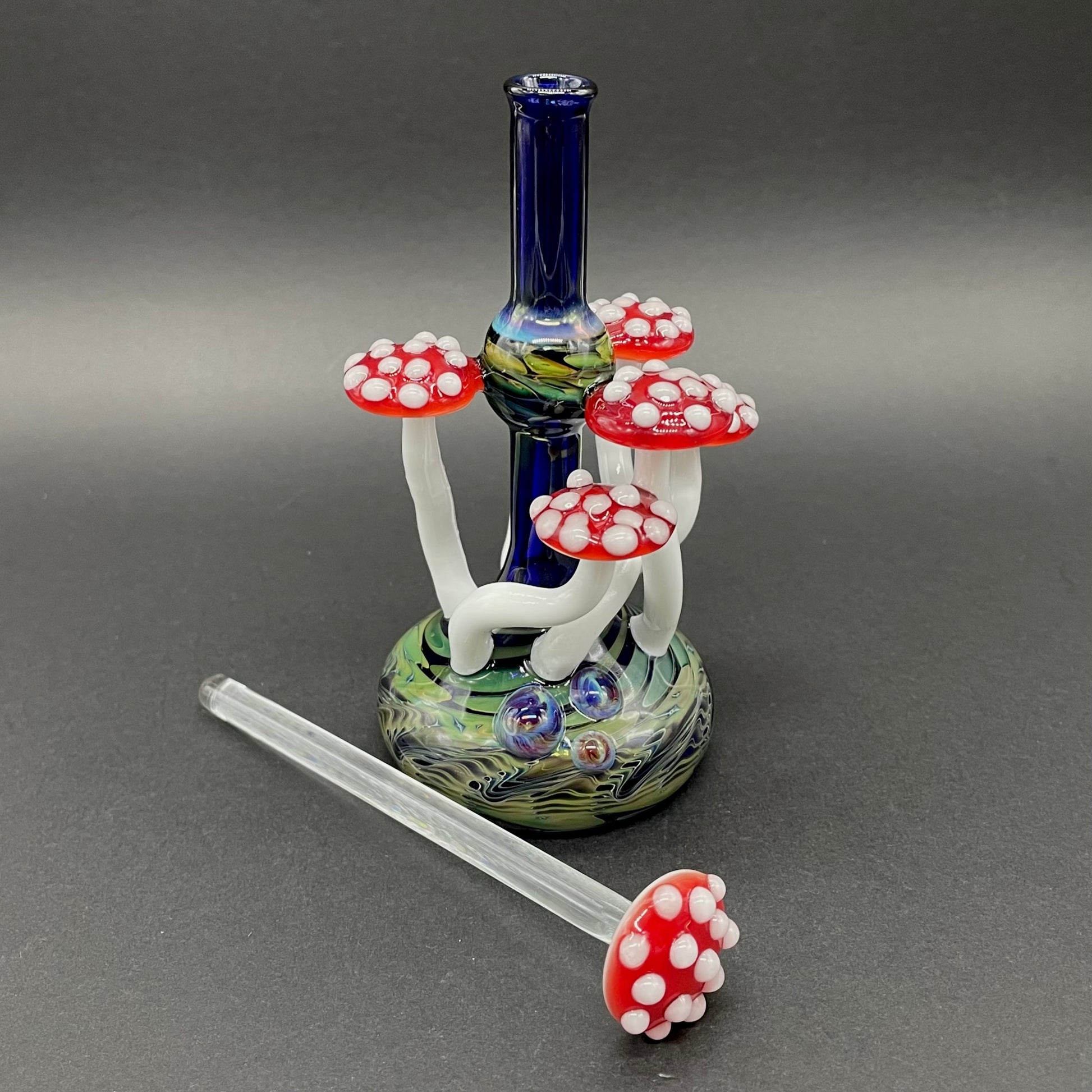 Close-up of Red cap Mushroom perfume bottle - handcrafted glass