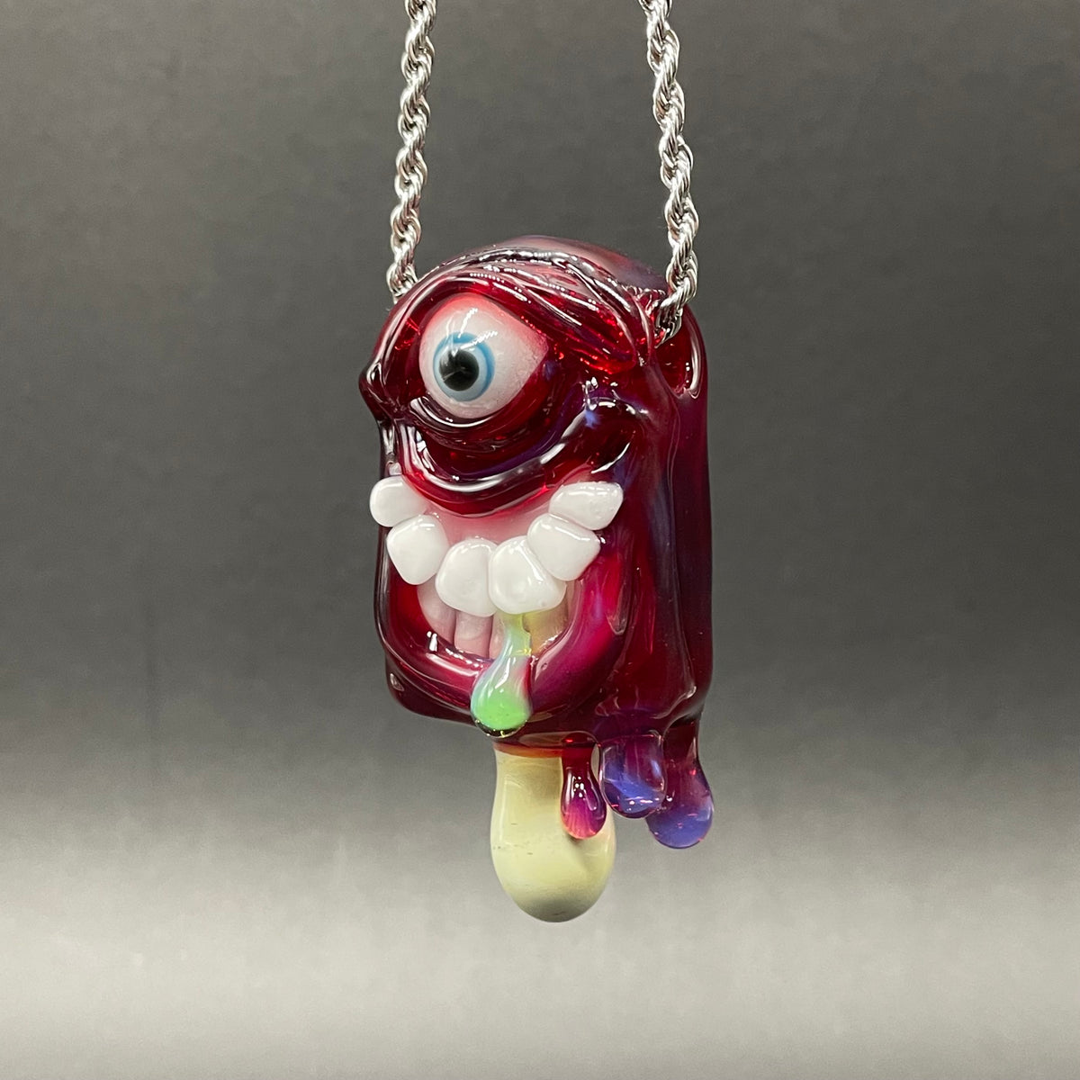 Hand-blown glass Drippy popsicle pendant by Leviathan Glass