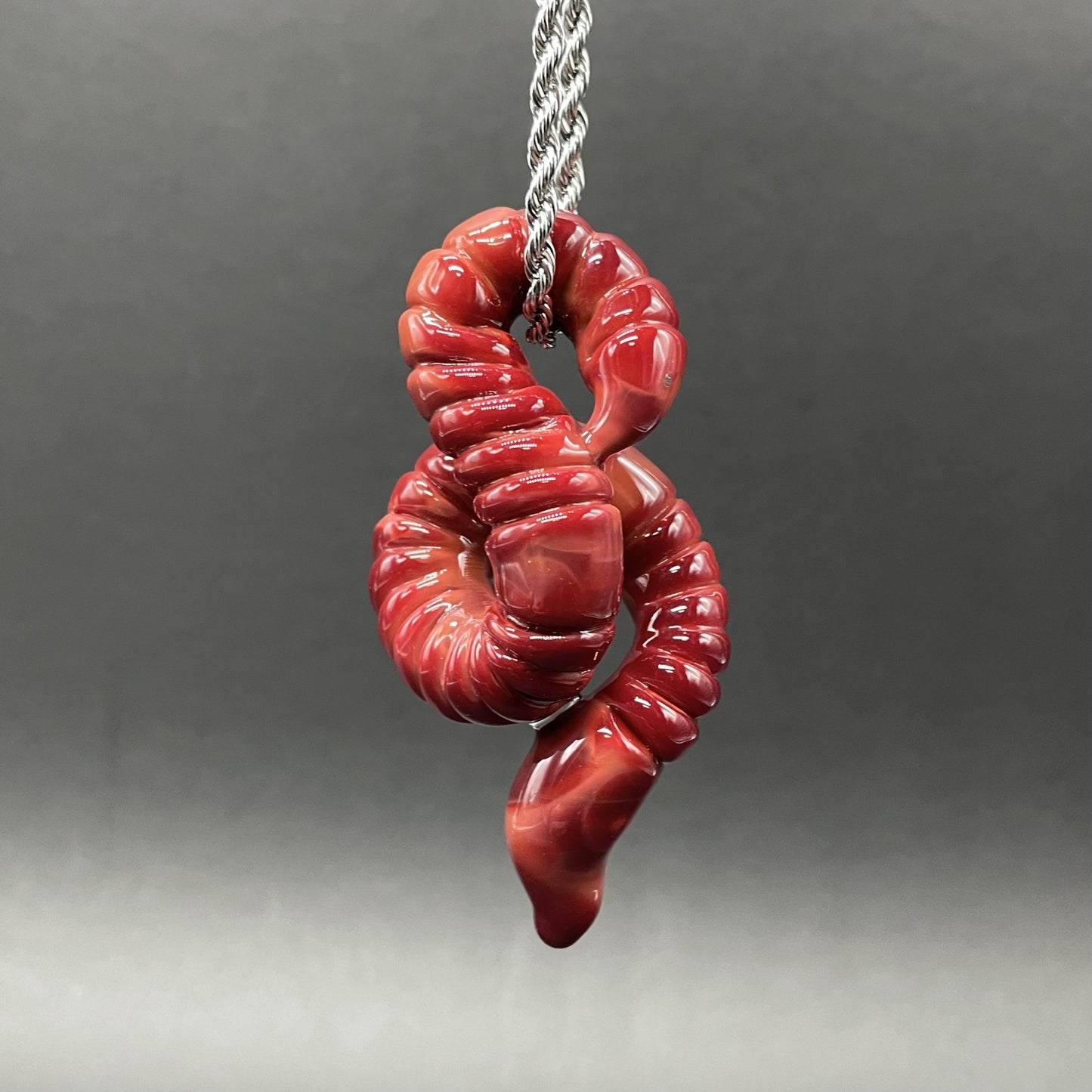 Hand-blown glass glass earthworm pendant by Leviathan Glass