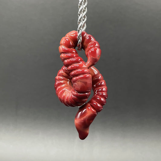 Hand-blown glass glass earthworm pendant by Leviathan Glass