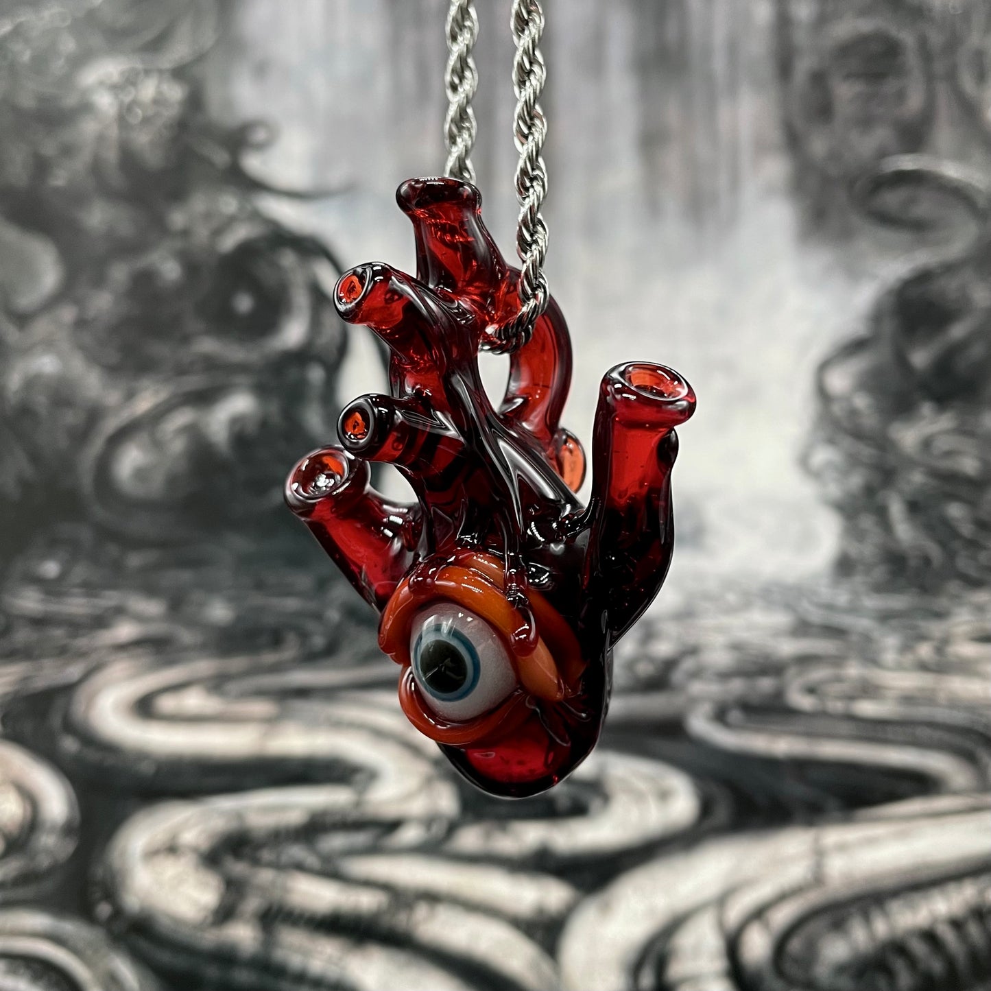 Hand-blown glass Anatomical cyclops heart pendant by Leviathan Glass